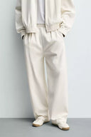 JOGGINGBROEK WIDE FIT MET PLOOIEN  Ecru