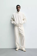 JOGGINGBROEK WIDE FIT MET PLOOIEN  Ecru